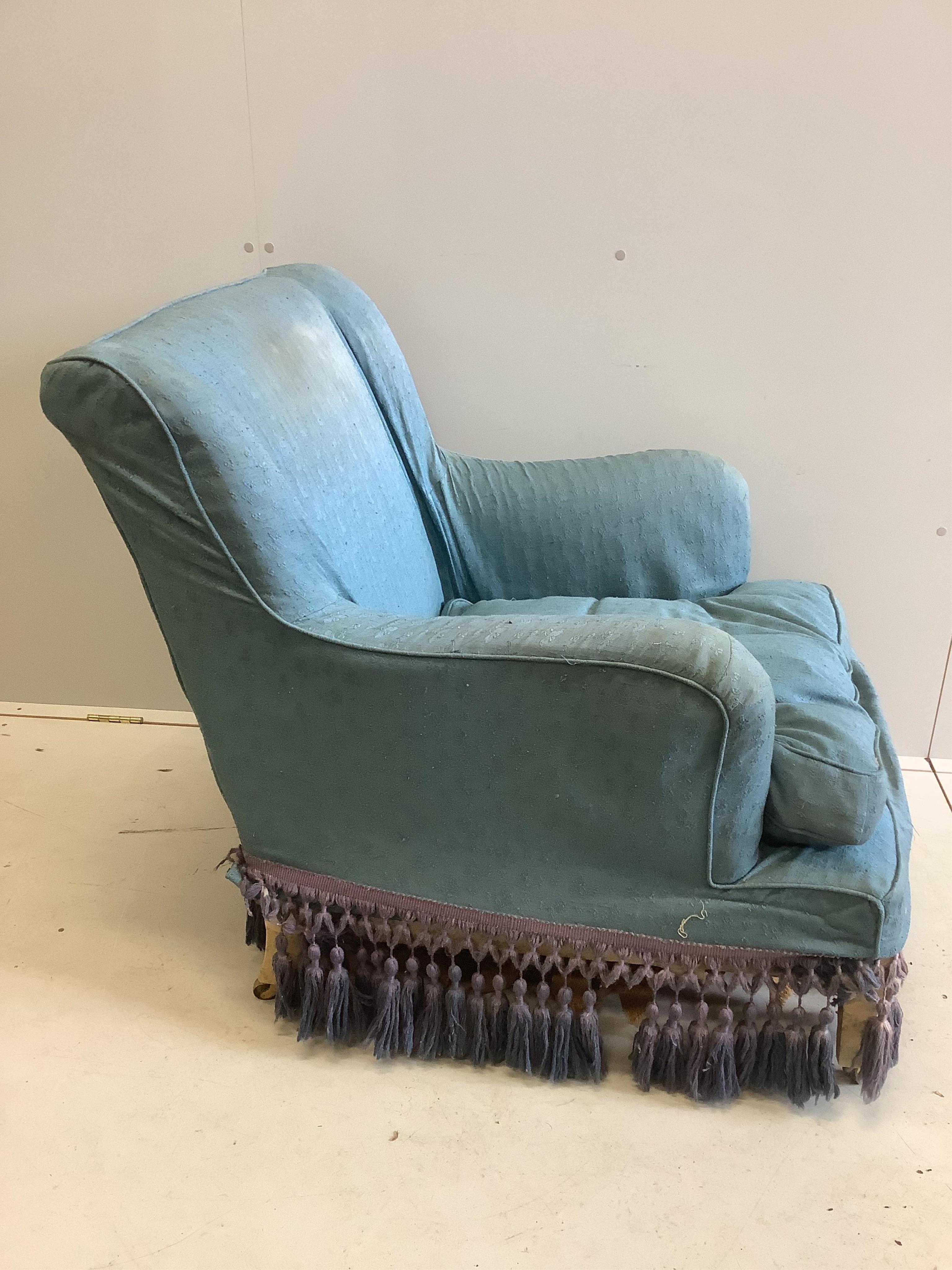 A Victorian blue upholstered Howard style wing armchair, width 72cm, depth 90cm, height 87cm. Condition - poor to fair